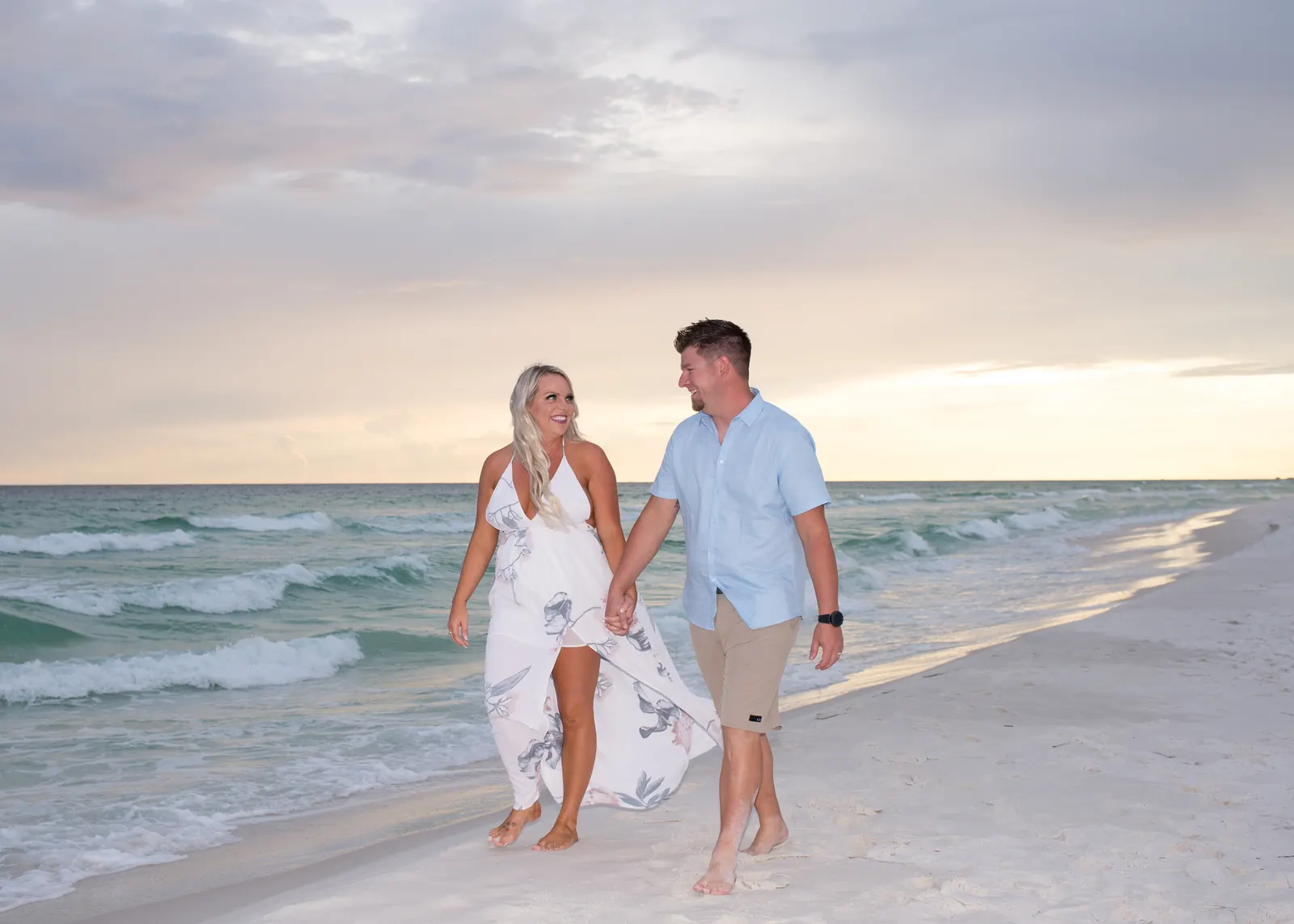 Couple walking along the water